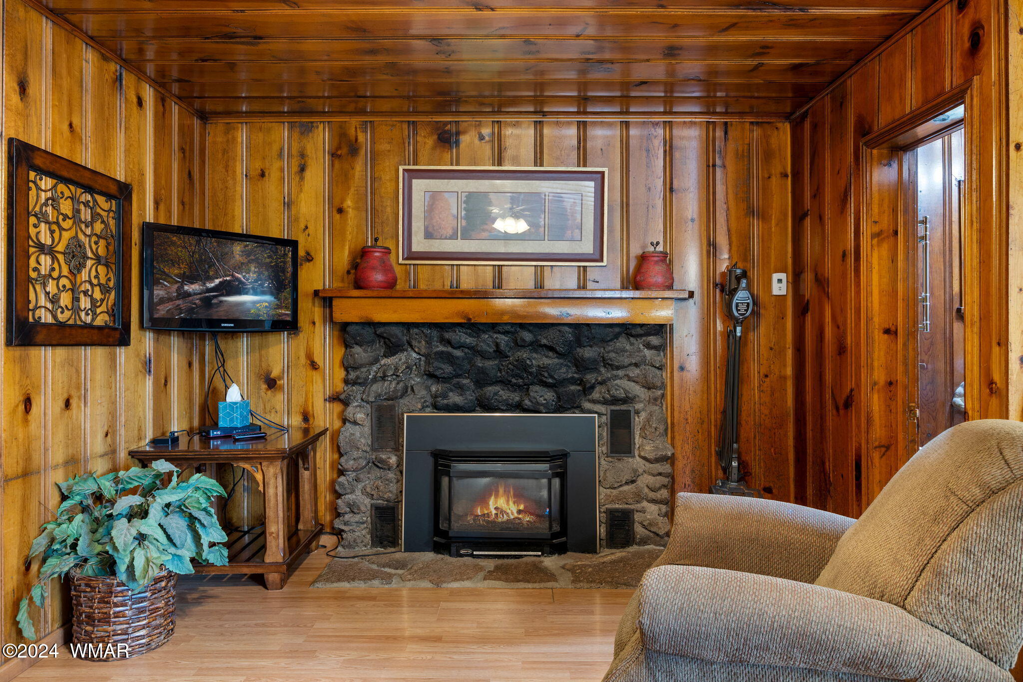 5 N1103, Unit ASPEN Greer, AZ 85927 - Photo 1 of 1 a living room with furniture and a fireplace