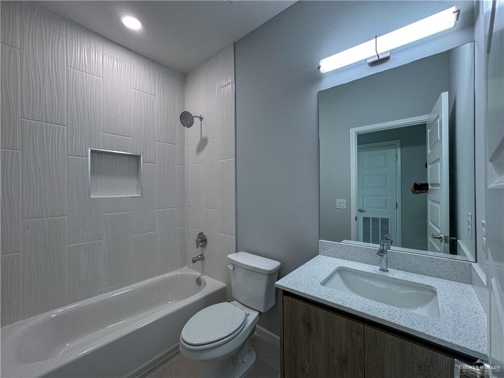 2705 Robin Road Weslaco, TX 78596 - Photo 4 of 8 a bathroom with a sink a toilet and shower