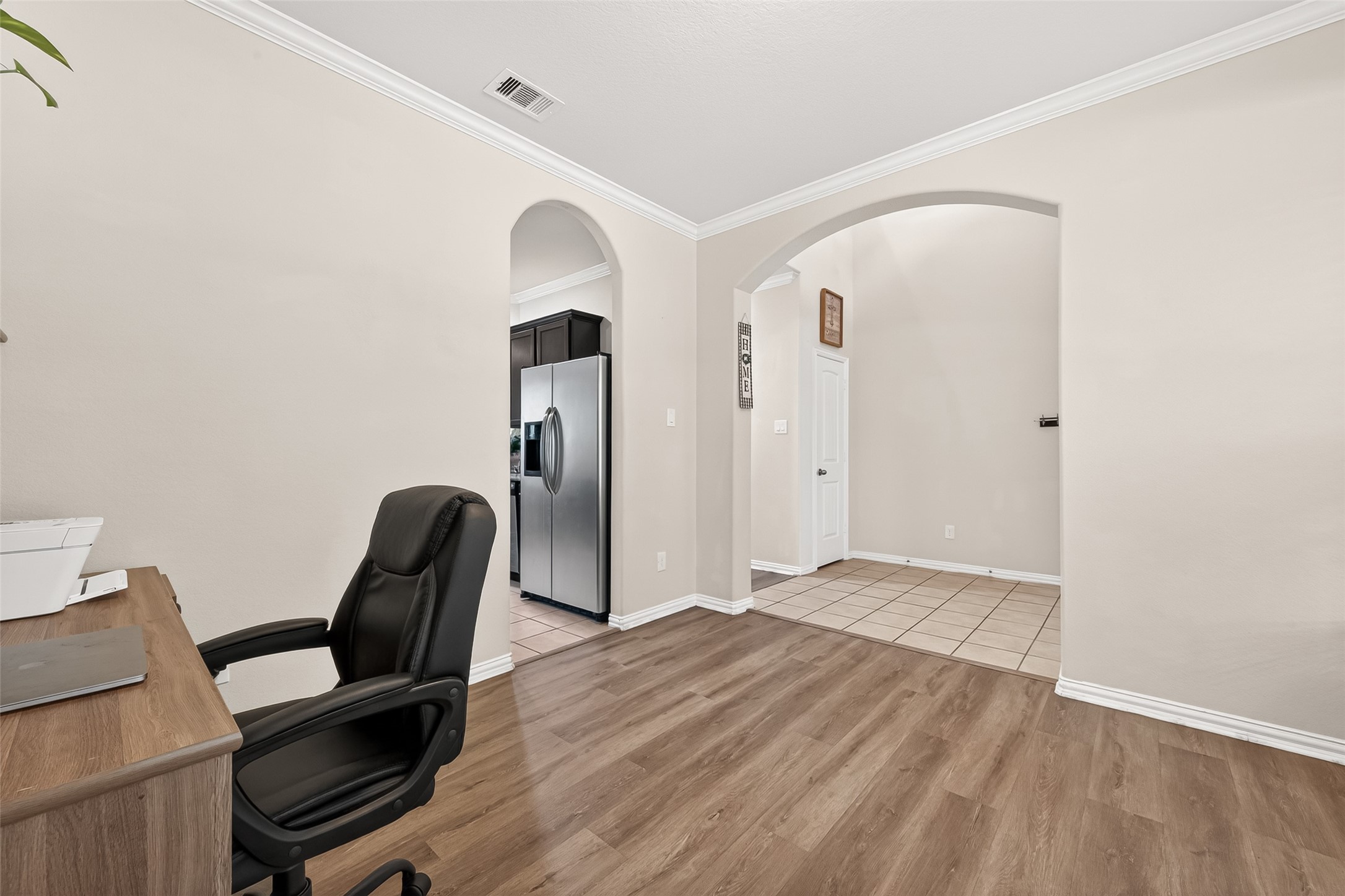 8 Landscape Court Conroe, TX 77301 - Photo 6 of 43 a view of a workspace with furniture and wooden floor