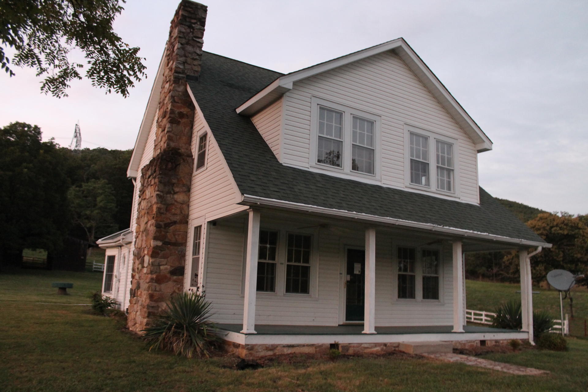 1145 Fralin Lane Blue Ridge, VA 24064 - Photo 1 of 12 a front view of a house with a garden