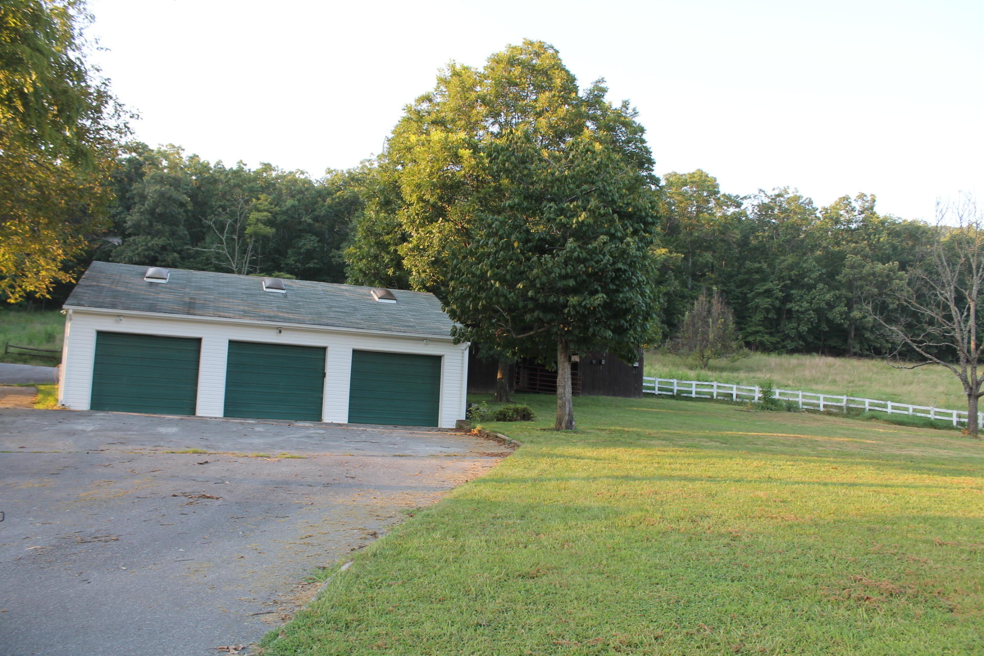 1145 Fralin Lane Blue Ridge, VA 24064 - Photo 11 of 12 a front view of a house with a yard and trees