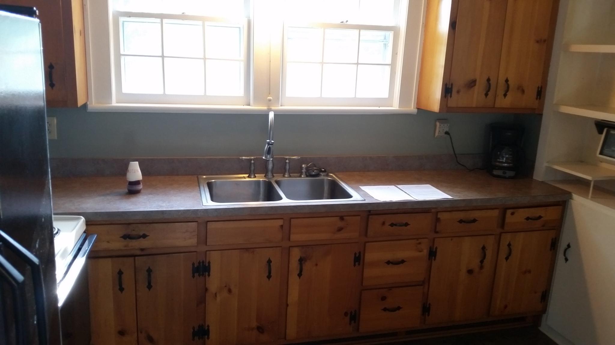 1145 Fralin Lane Blue Ridge, VA 24064 - Photo 4 of 12 a kitchen with a sink cabinets and a window