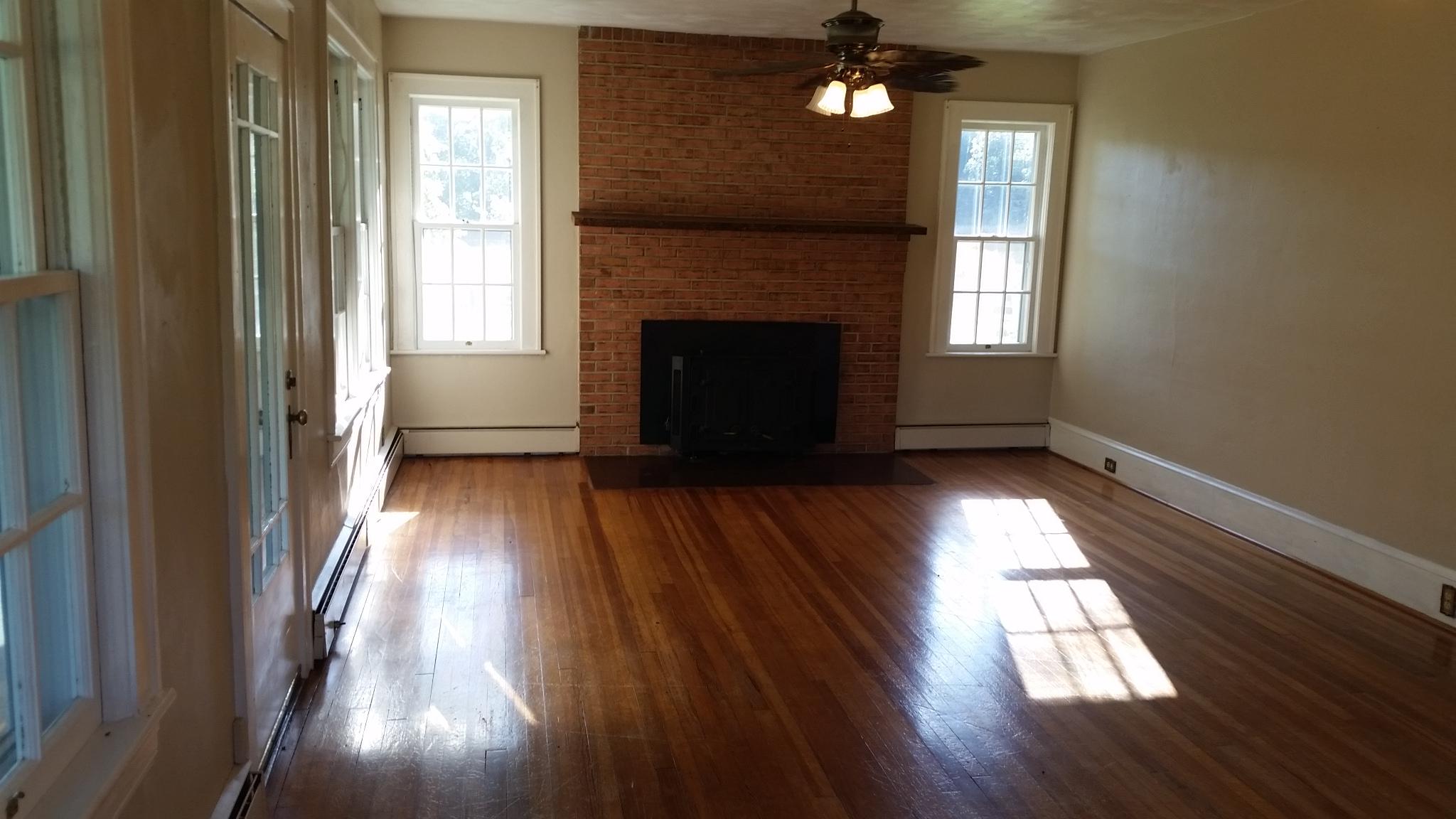 1145 Fralin Lane Blue Ridge, VA 24064 - Photo 5 of 12 wooden floor in an empty room with a window