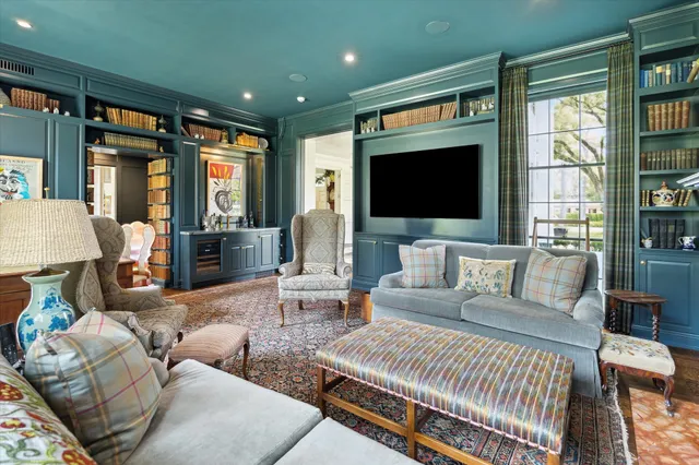 a dining room with a large window table and chair