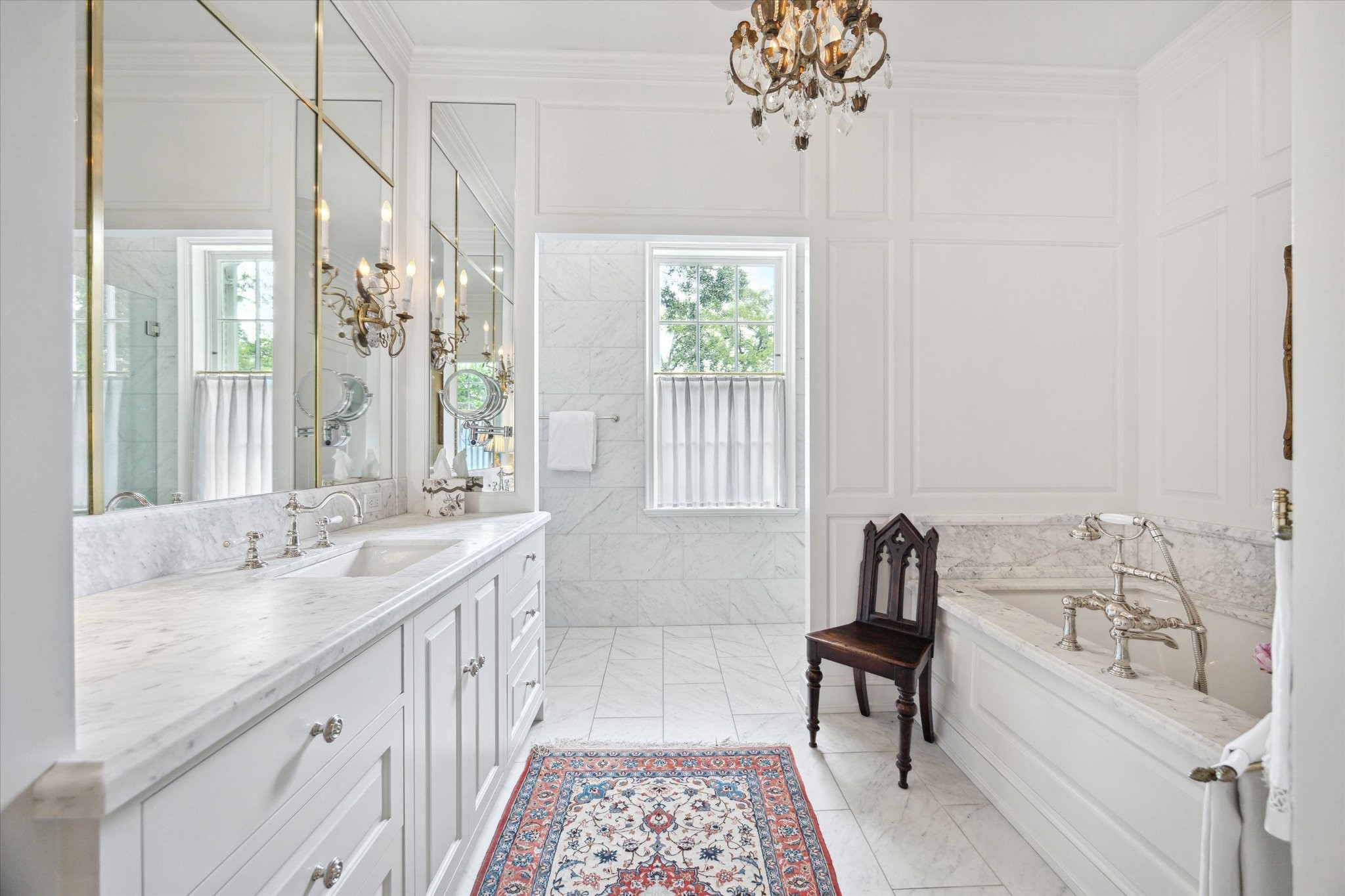 4019 Inverness Drive Houston, TX 77019 - Photo 24 of 49 a bathroom with a granite countertop sink a large mirror and a bathtub
