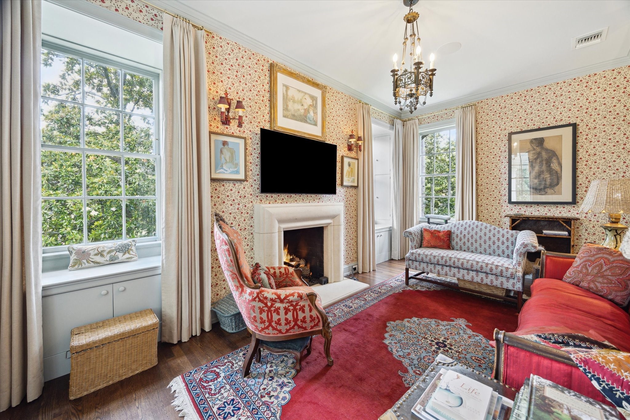 4019 Inverness Drive Houston, TX 77019 - Photo 26 of 49 a living room with furniture a flat screen tv and a fireplace
