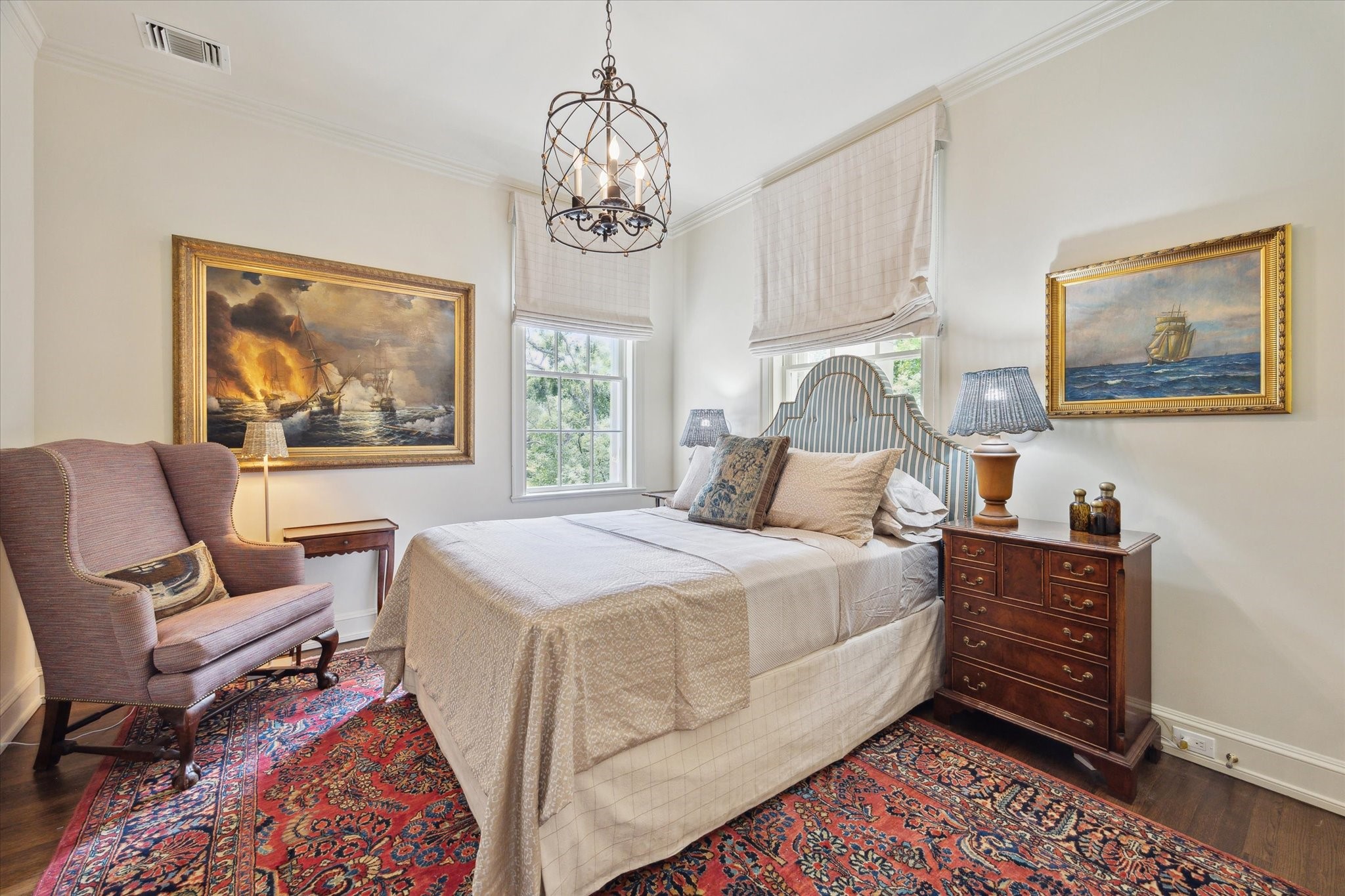 4019 Inverness Drive Houston, TX 77019 - Photo 29 of 49 a bedroom with a bed and a chandelier