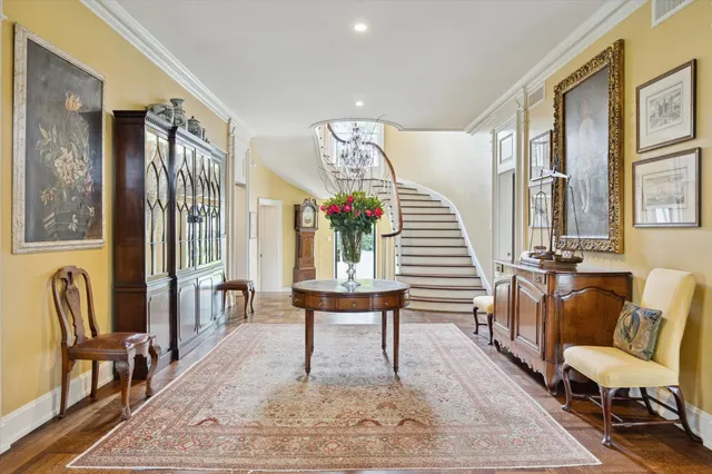 a living room with furniture and a chair
