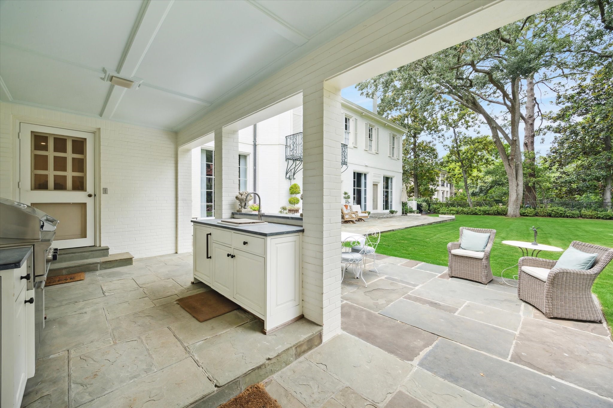 4019 Inverness Drive Houston, TX 77019 - Photo 42 of 49 a view of a house with backyard sitting area and garden