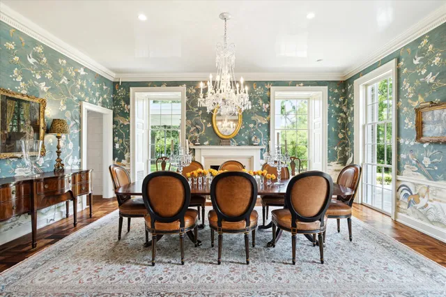 a view of a dining room with furniture wooden floor and chandelier