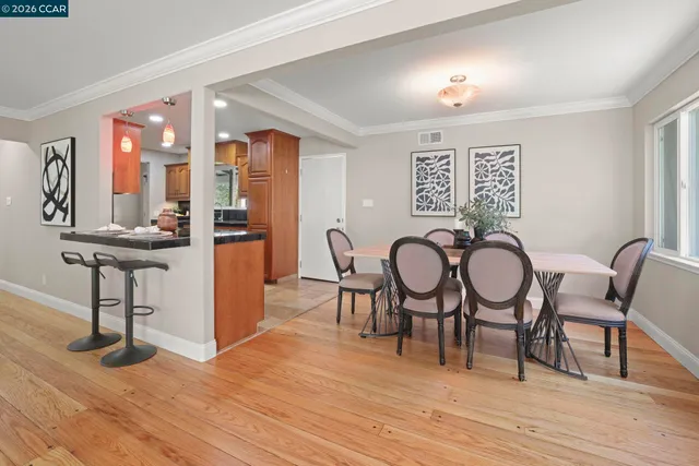 a view of a livingroom with furniture and wooden floor
