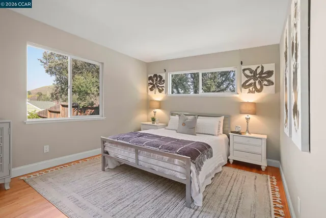 a bedroom with a bed and a window with outer view