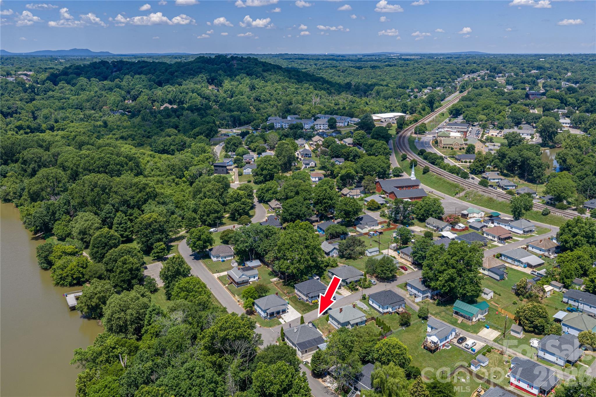 58 Fourth Street Cramerton, NC 28032 - Photo 16 of 44 an aerial view of residential houses with outdoor space and a lake view