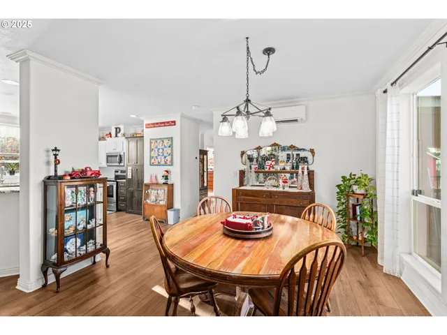 a view of a dining room with furniture and chandelier