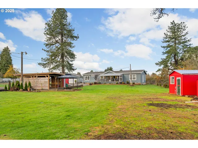 a front view of a house with a big yard