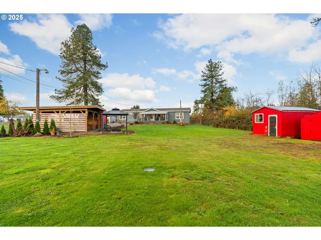 a view of a house with a big yard