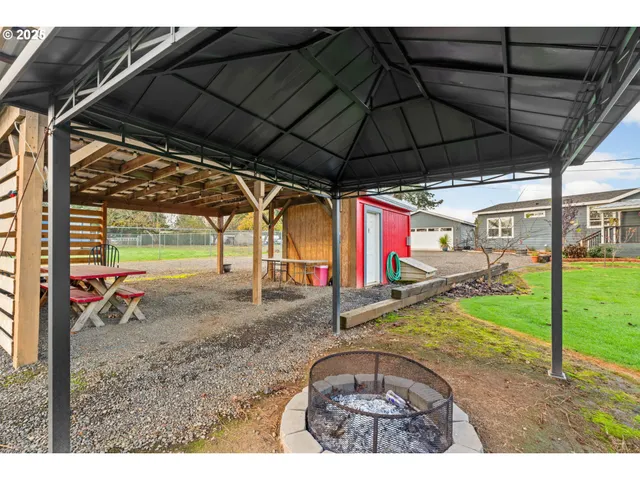 a view of a backyard with wooden floor