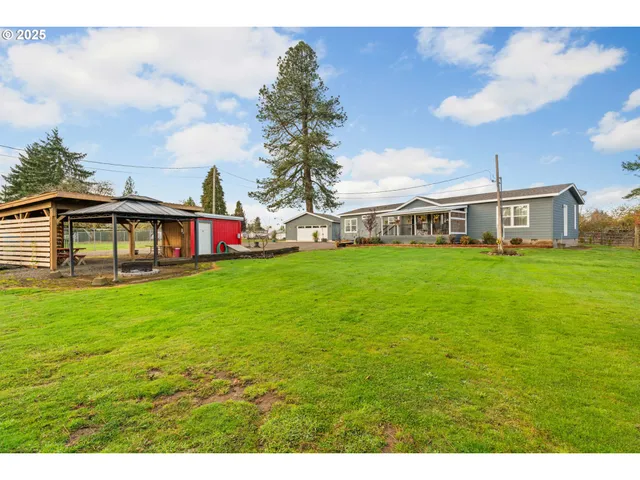 a view of a house with a big yard