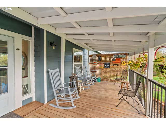 a view of a chairs and table in the patio