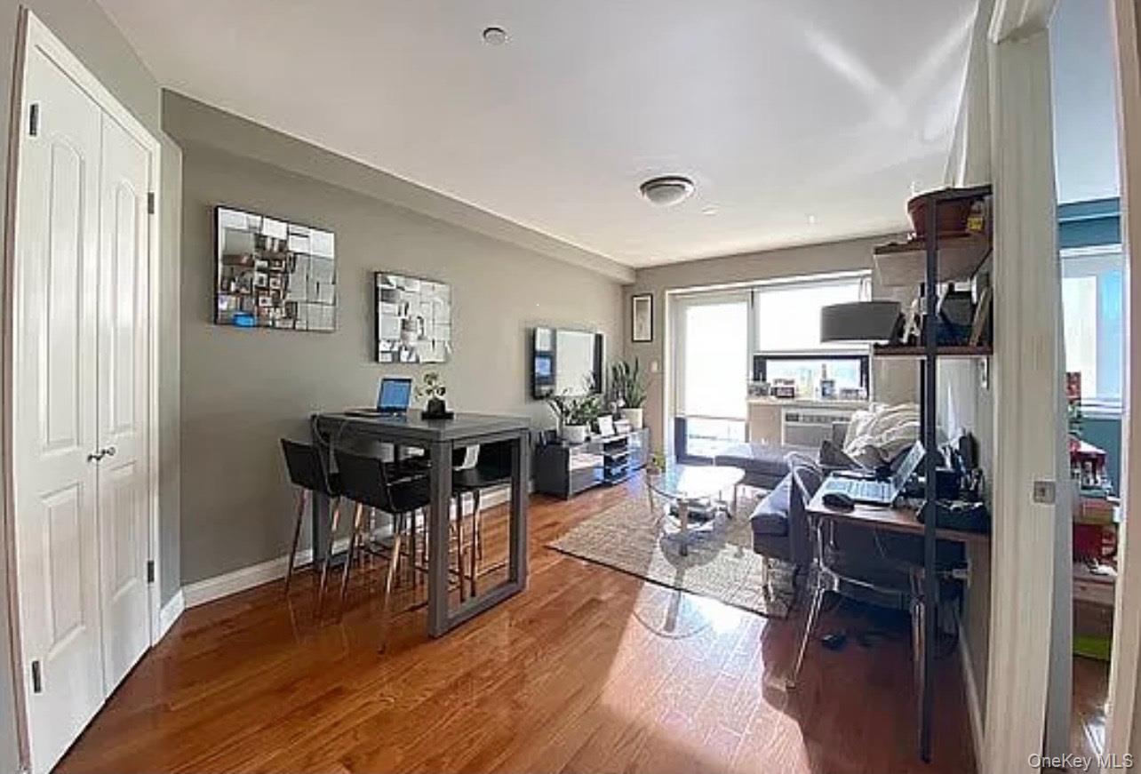 456 West 167th Street, Unit 6C Manhattan, NY 10032 - Photo 2 of 11 a view of a dining room with furniture and wooden floor