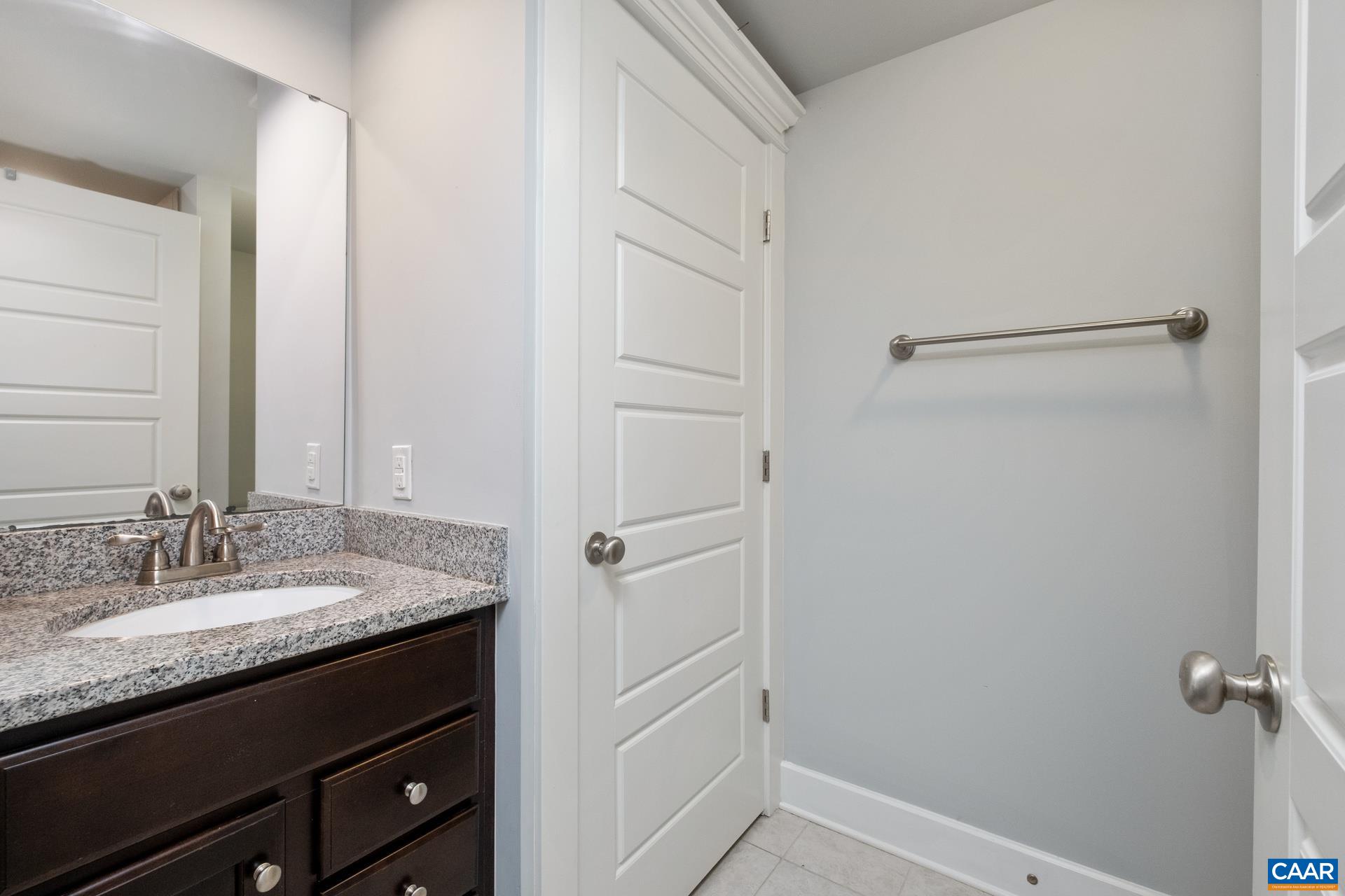 2032 Avinity Loop Charlottesville, VA 22902 - Photo 23 of 35 a bathroom with a granite countertop sink and a mirror