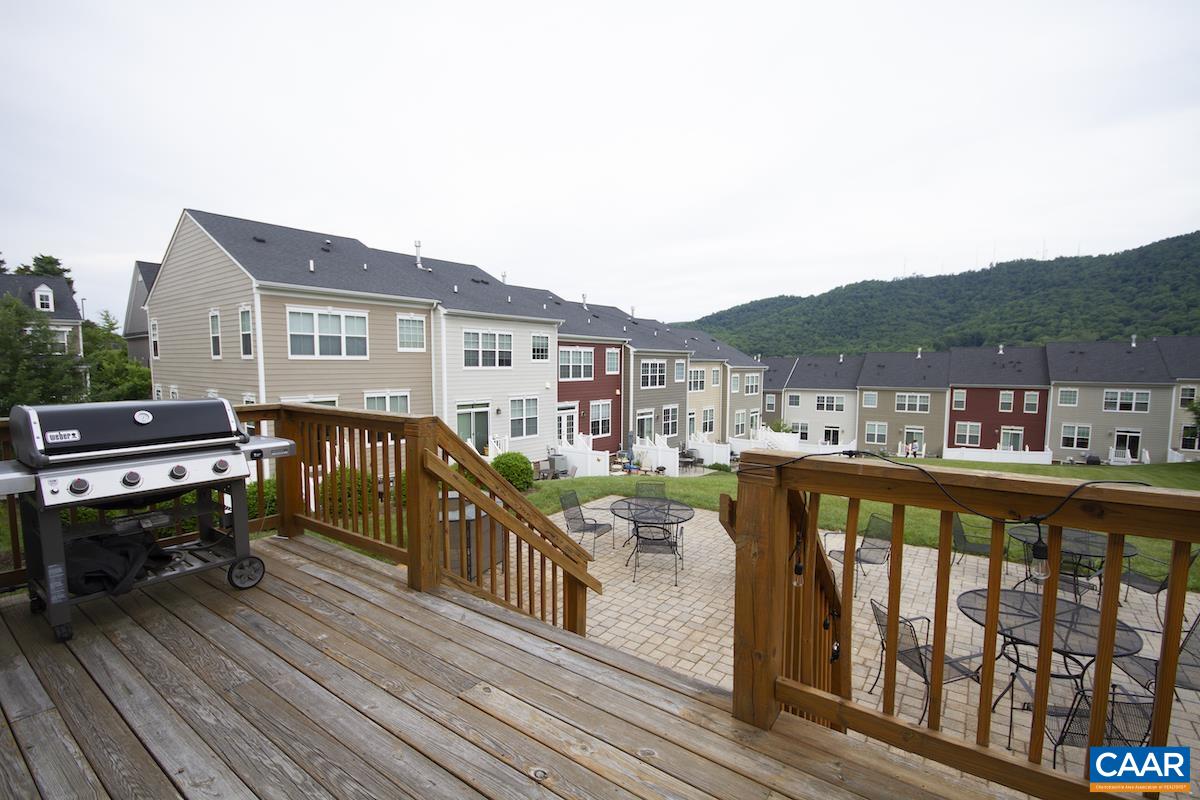 2032 Avinity Loop Charlottesville, VA 22902 - Photo 30 of 35 a view of a balcony with wooden floor and outdoor seating