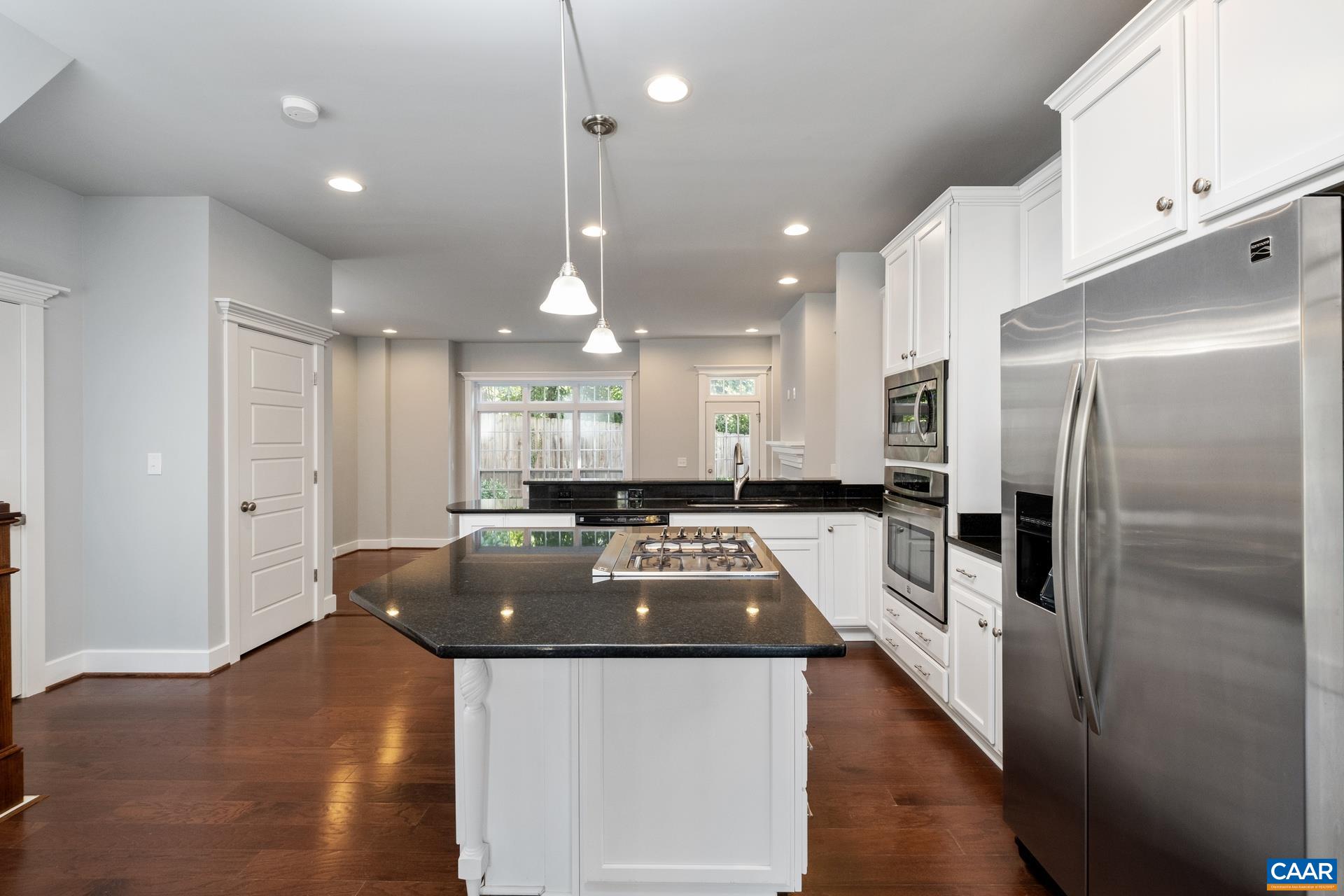 2032 Avinity Loop Charlottesville, VA 22902 - Photo 4 of 35 a kitchen with a refrigerator a counter top space