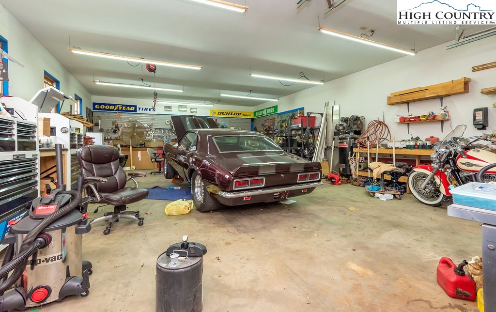 2136 Little Laurel Road Creston, NC 28615 - Photo 20 of 44 a view of parking garage with cars and bicycles