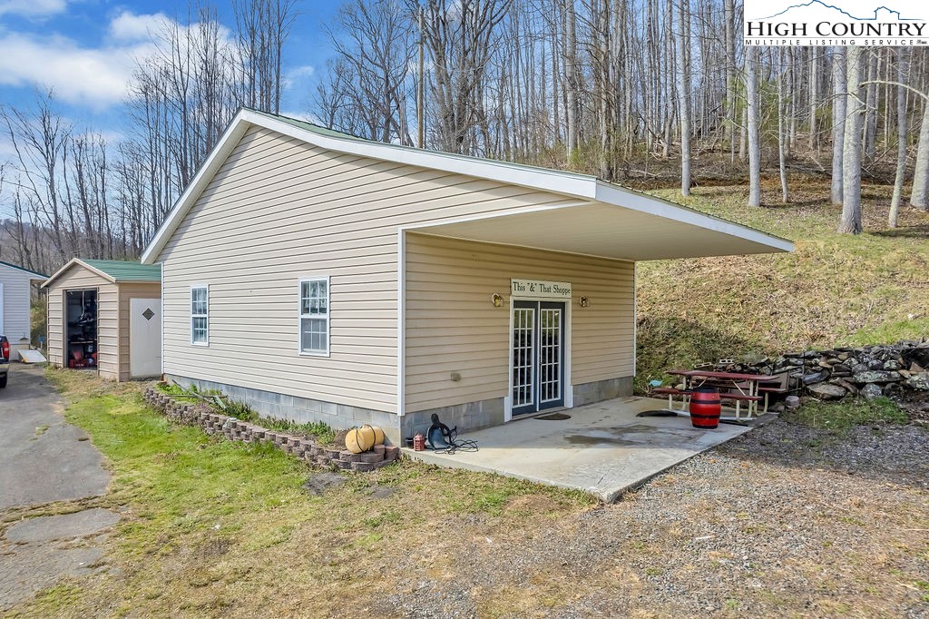 2136 Little Laurel Road Creston, NC 28615 - Photo 26 of 44 a view of a house with backyard and sitting area