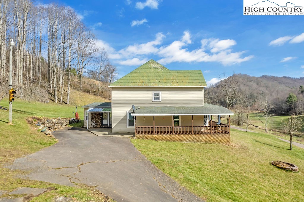 2136 Little Laurel Road Creston, NC 28615 - Photo 5 of 44 a view of a house with a swimming pool