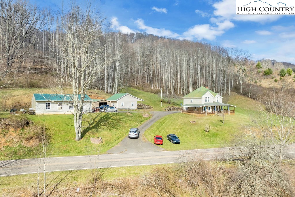2136 Little Laurel Road Creston, NC 28615 - Photo 6 of 44 a view of a swimming pool with a yard