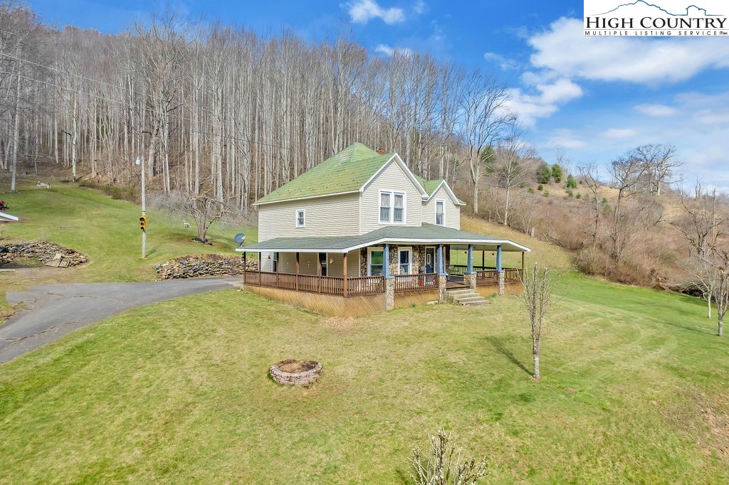 2136 Little Laurel Road Creston, NC 28615 - Photo 8 of 44 a front view of a house with swimming pool