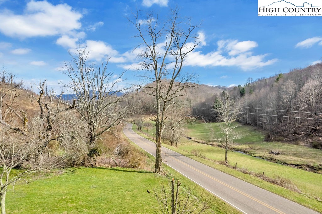 2136 Little Laurel Road Creston, NC 28615 - Photo 10 of 44 a view of a backyard of the house