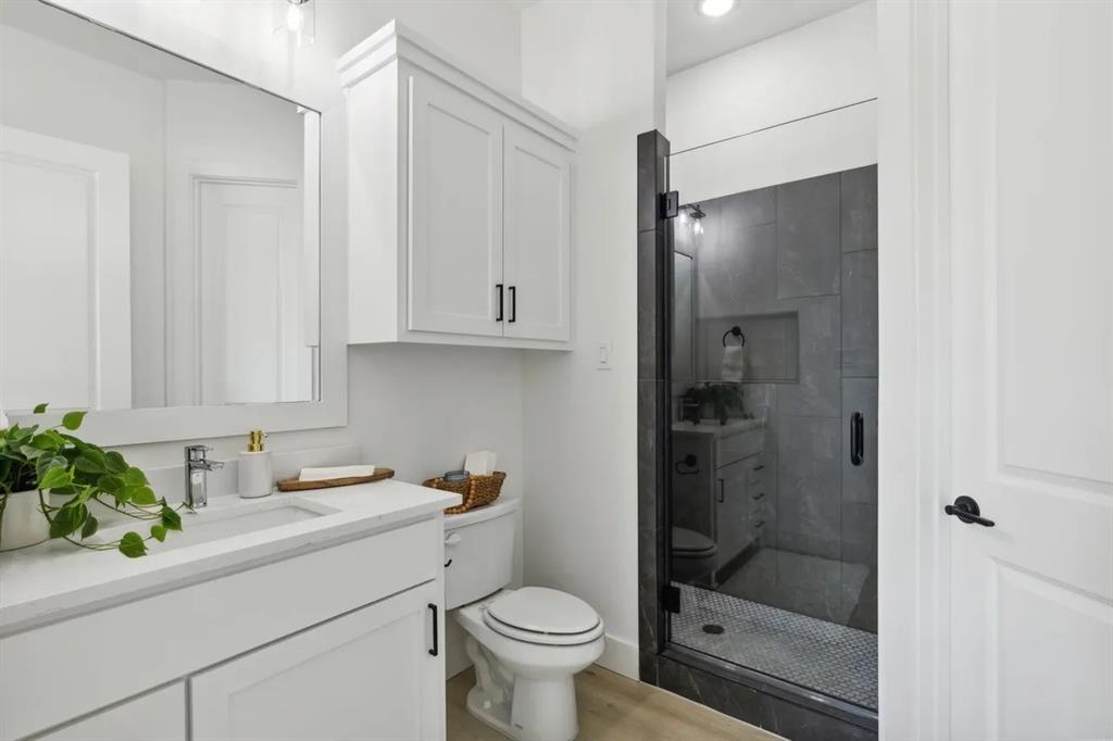 1310 Benjamin Trail Van Alstyne, TX 75495 - Photo 24 of 27 Full bath with vanity, a shower stall, and light wood-type flooring