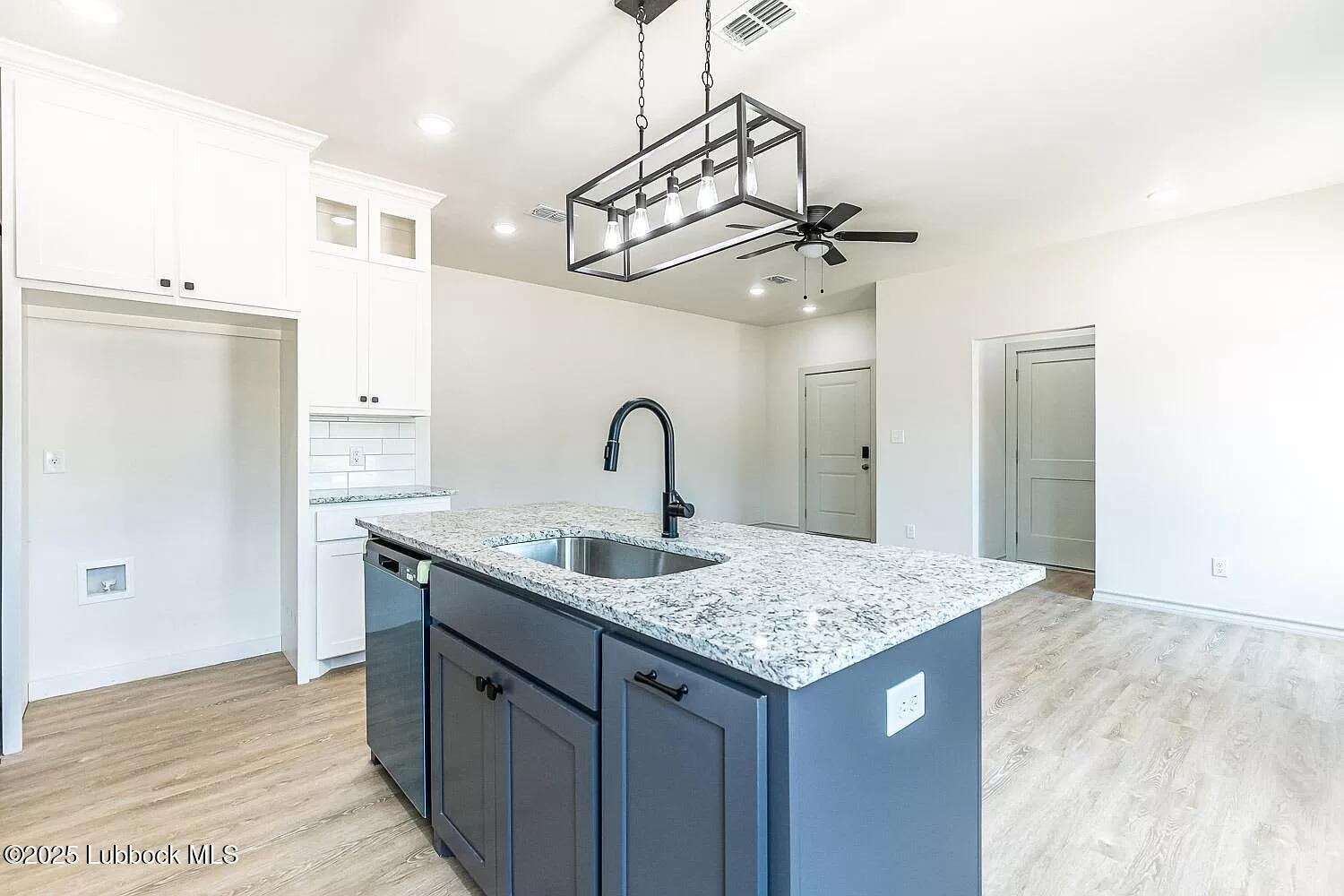 2113 20th Street, Unit A & B Lubbock, TX 79411 - Photo 18 of 31 a view of a kitchen counter space a sink and dishwasher