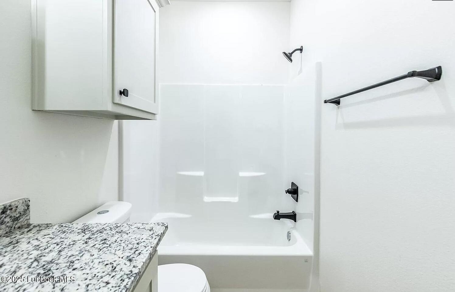 2113 20th Street, Unit A & B Lubbock, TX 79411 - Photo 22 of 31 a bathroom with a bathtub and shower