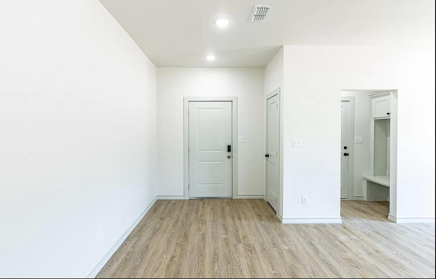 2113 20th Street, Unit A & B Lubbock, TX 79411 - Photo 26 of 31 a view of a room with wooden floor and a hallway