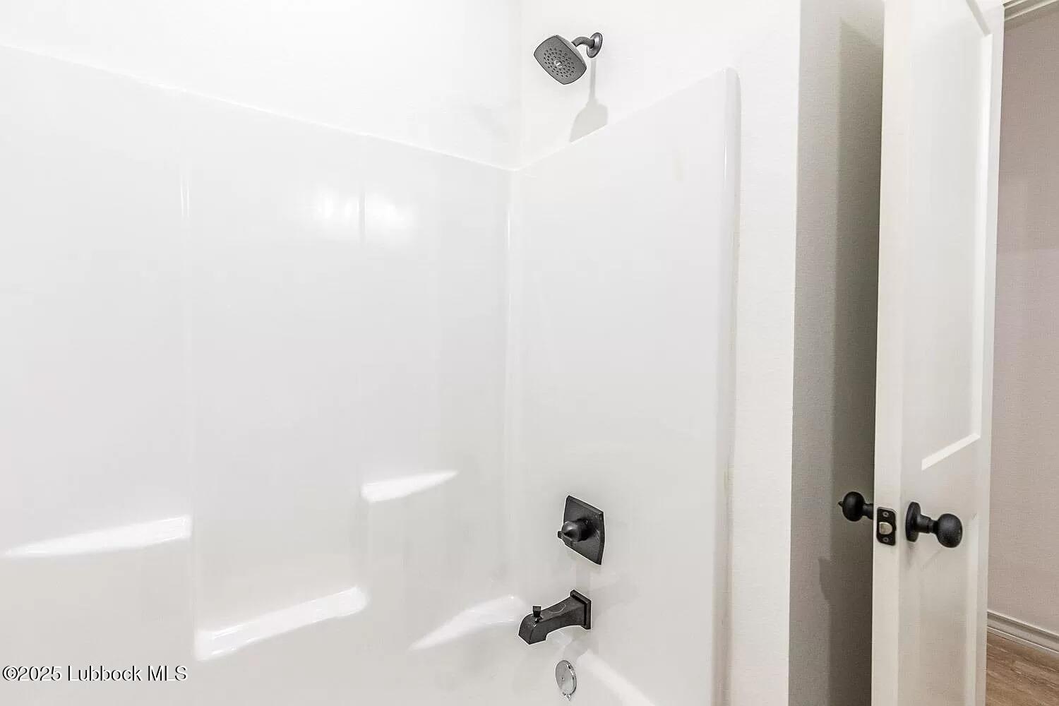 2113 20th Street, Unit A & B Lubbock, TX 79411 - Photo 8 of 31 a bathroom with a shower