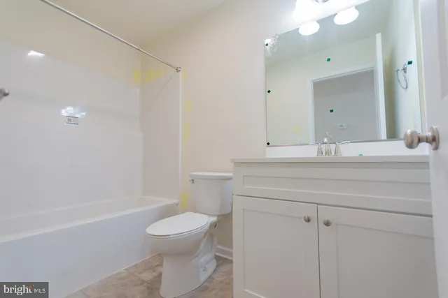 a bathroom with a sink a toilet and a bathtub