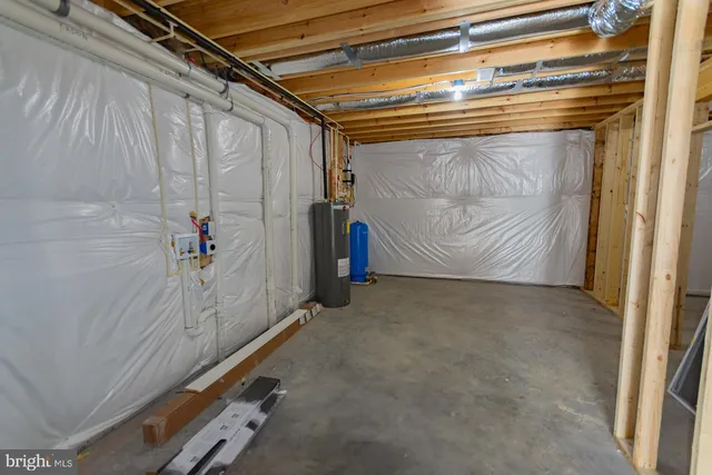 a view of dirt yard with a large tree