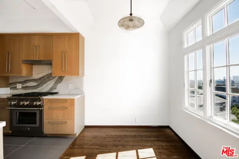 a kitchen with a stove and a cabinet