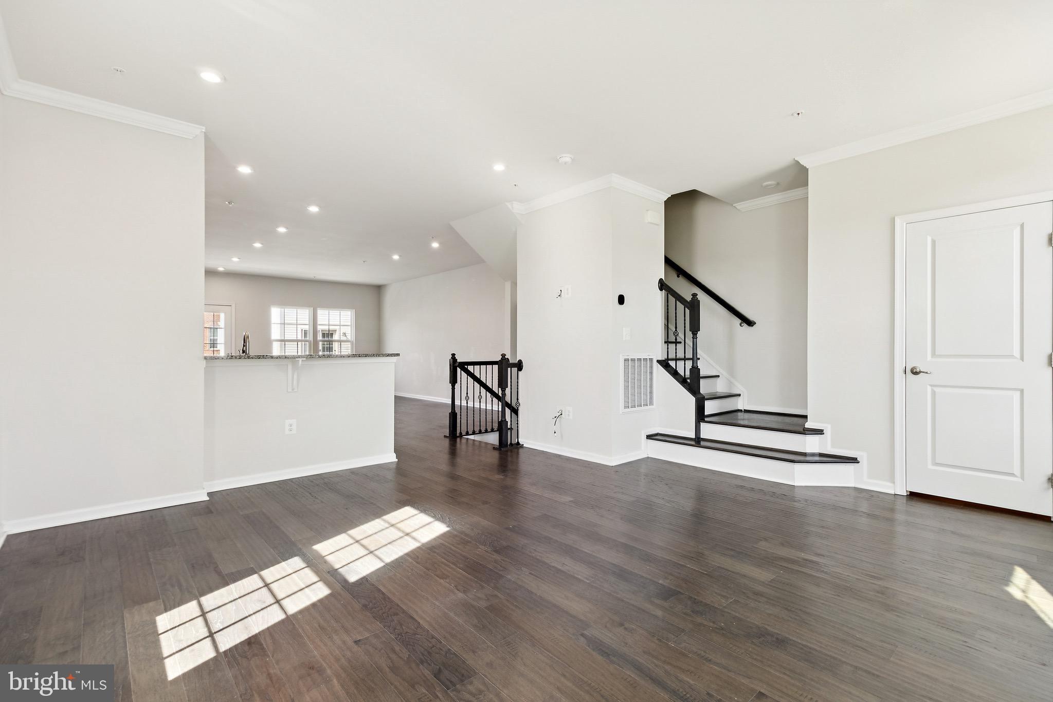 5329 Woodyard Road Upper Marlboro, MD 20772 - Photo 11 of 25 a view of empty room with wooden floor and stairs