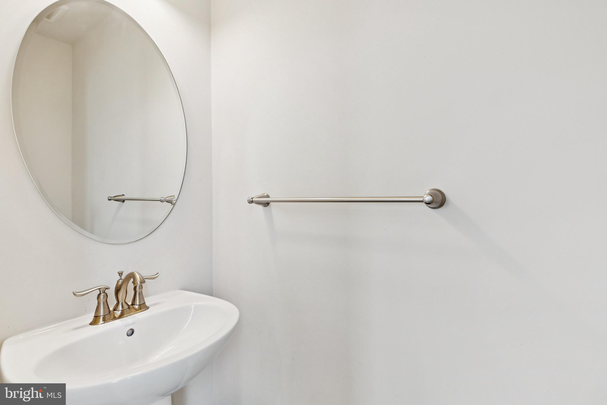 5329 Woodyard Road Upper Marlboro, MD 20772 - Photo 12 of 25 a bathroom with a sink and a mirror