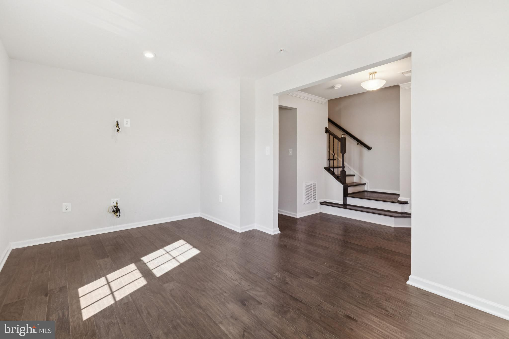 5329 Woodyard Road Upper Marlboro, MD 20772 - Photo 5 of 25 an empty room with wooden floor and deck