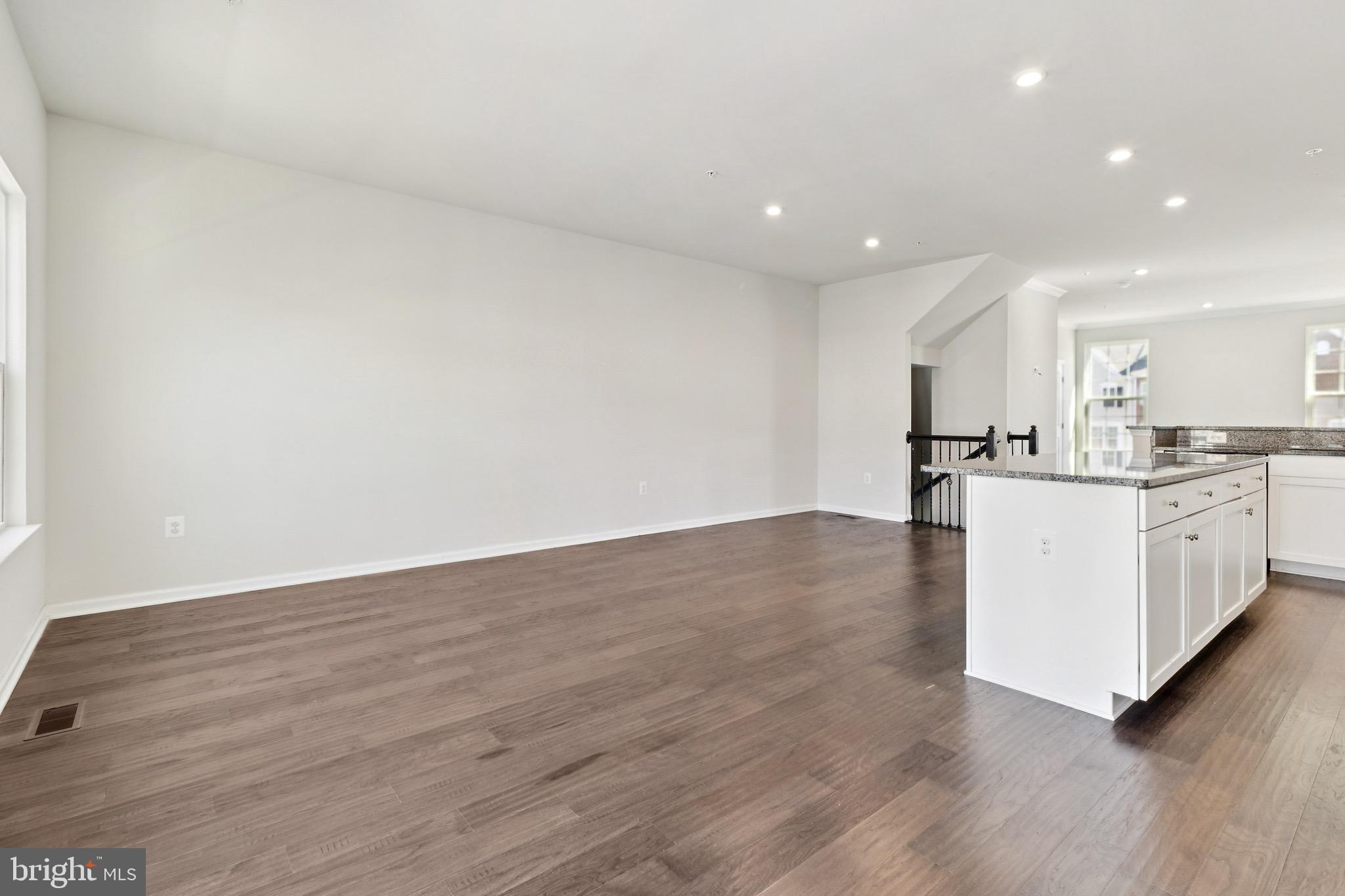 5329 Woodyard Road Upper Marlboro, MD 20772 - Photo 10 of 25 a view of kitchen with wooden floor center island and stainless steel appliances