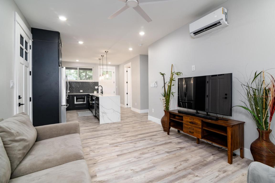 7905-7907 Tiffany Drive Austin, TX 78749 - Photo 17 of 37 a living room with furniture and a flat screen tv