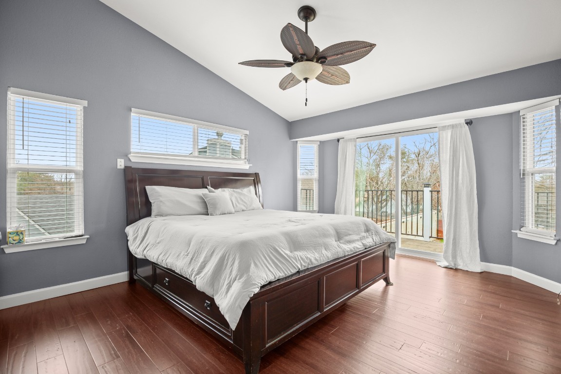 7905-7907 Tiffany Drive Austin, TX 78749 - Photo 25 of 37 a large bed sitting in a bedroom next to a window