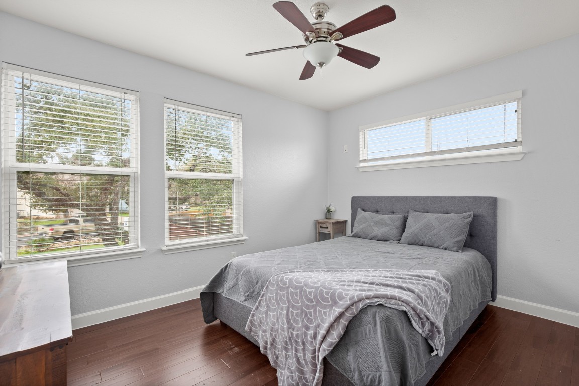 7905-7907 Tiffany Drive Austin, TX 78749 - Photo 27 of 37 a bedroom with a large bed and a window