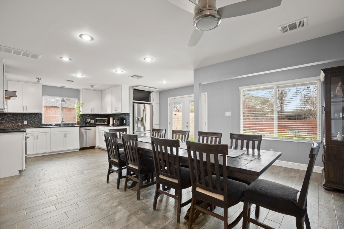 7905-7907 Tiffany Drive Austin, TX 78749 - Photo 31 of 37 a view of a dining room with furniture window and wooden floor