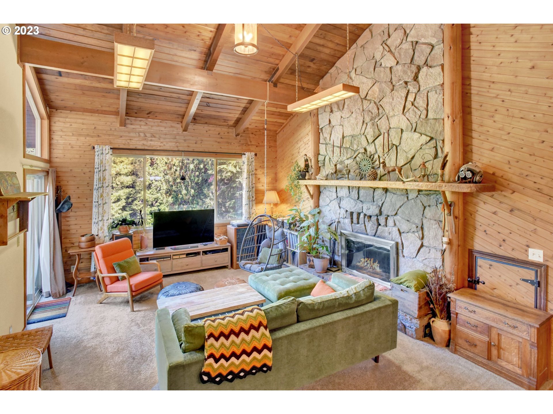 43011 Southeast Keisecker Road Sandy, OR 97055 - Photo 9 of 48 a living room with furniture a fireplace and a flat screen tv